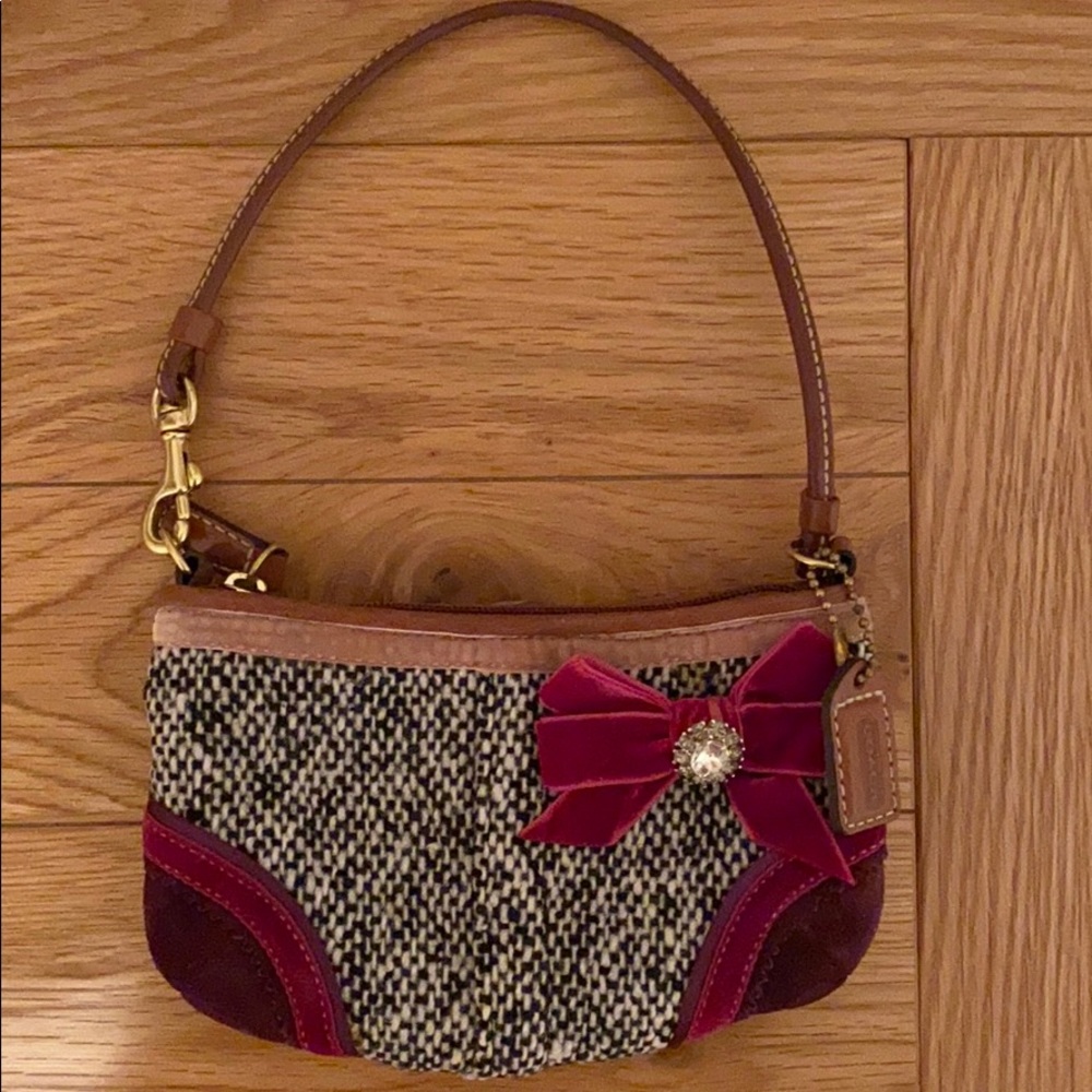 Brand new wristlet coach rare limited addition.  Tweed soho tag chain coach
